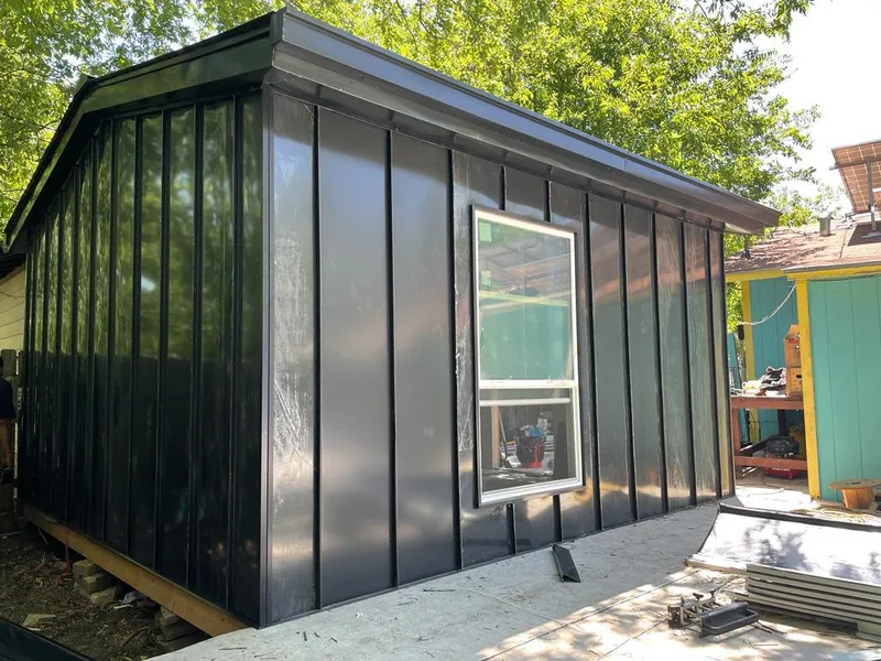 Black standing seam metal wall panels for Metal Roof Installation in Tipton